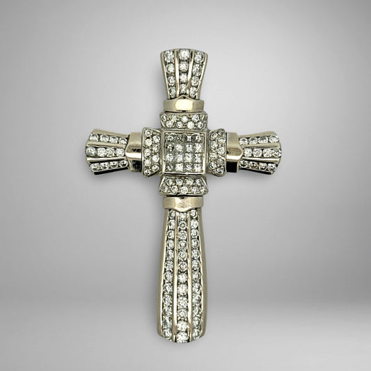 White gold diamond cross pendant with on a gray background
