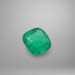 Green emerald gemstone on a gray background