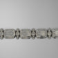 White gold diamond bracelet on grey background