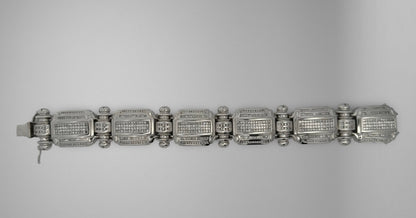 White gold diamond bracelet on grey background