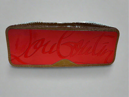 Bottom of bag with red leather and "Louboutin" in big cursive letters. Scuff mark on bottom of bag.