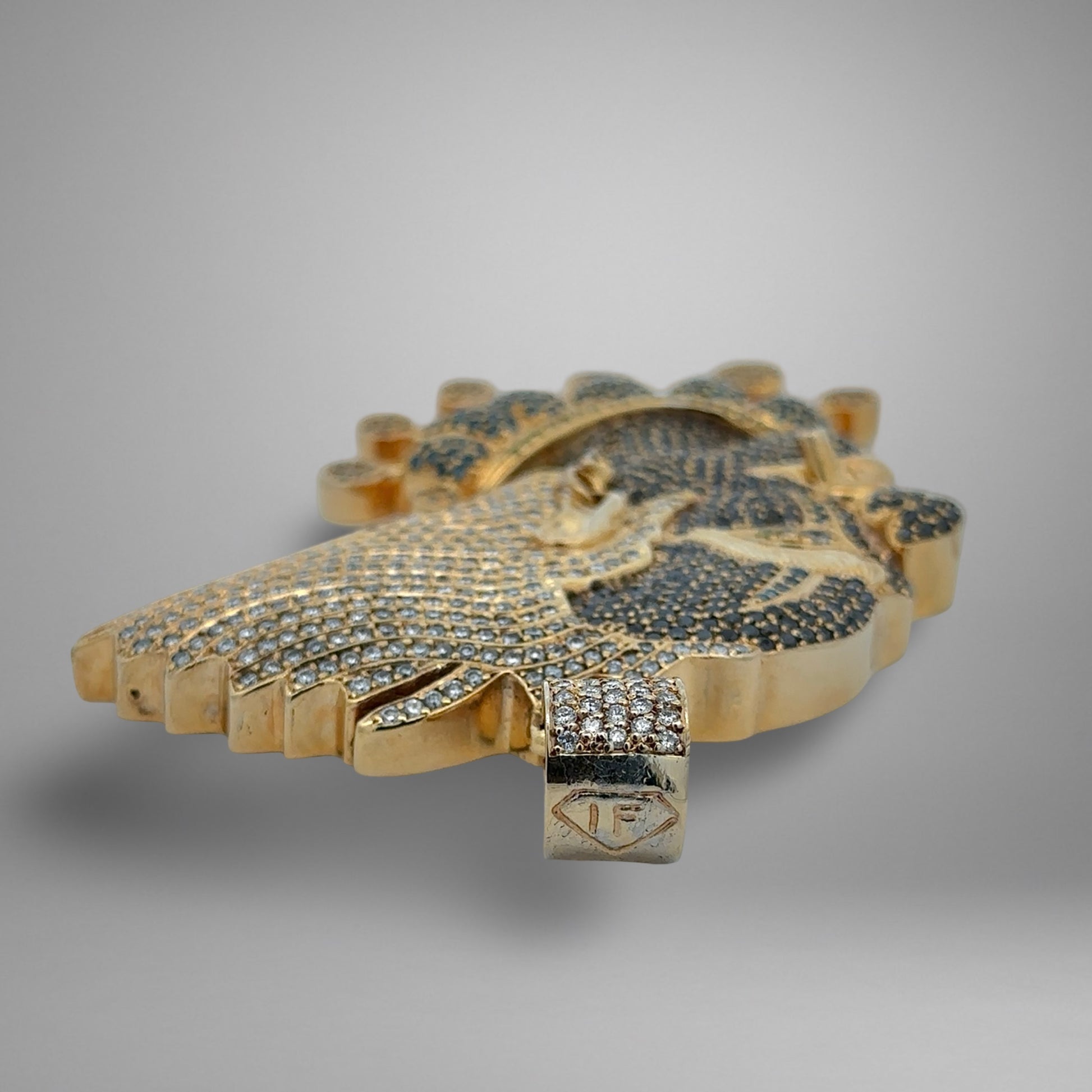 Top of clown pendant with logo