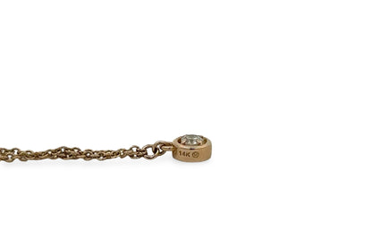 14K stamp on bezel-set diamond