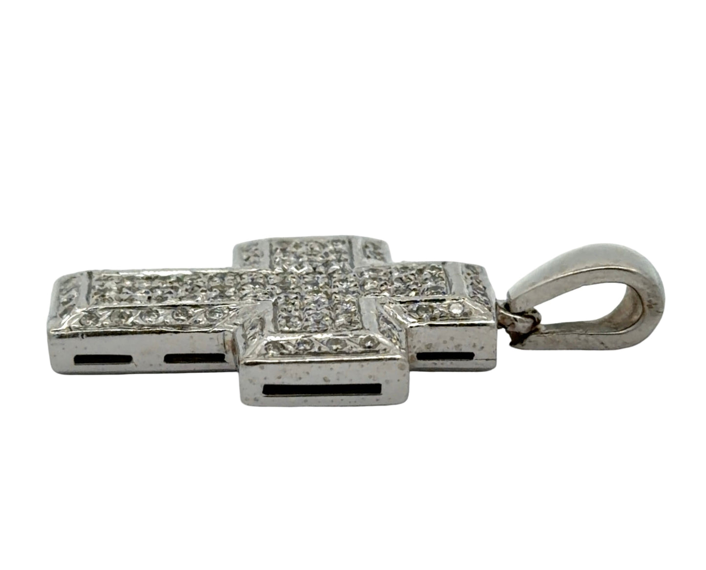 Side of white gold cross pendant