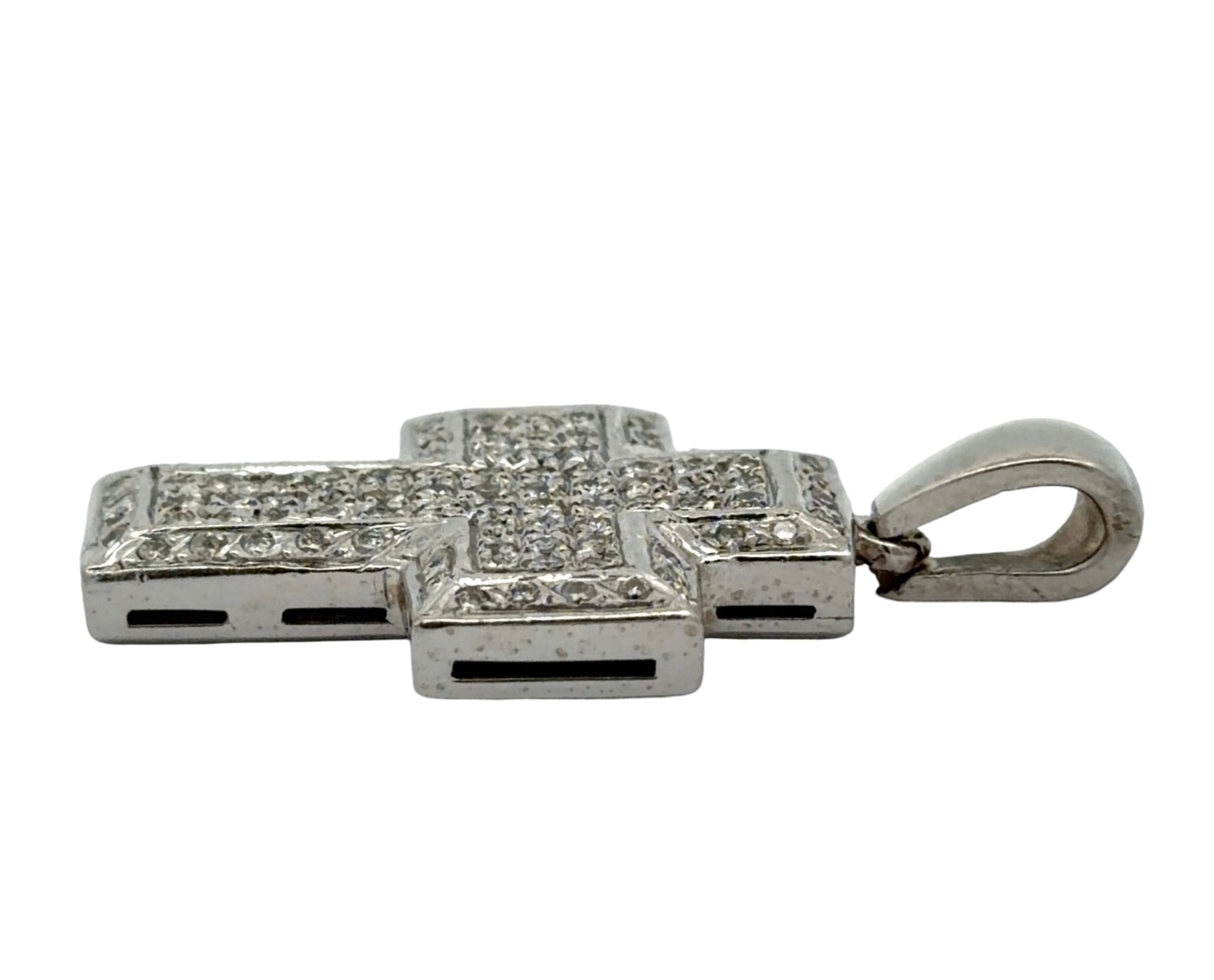 Side of white gold cross pendant