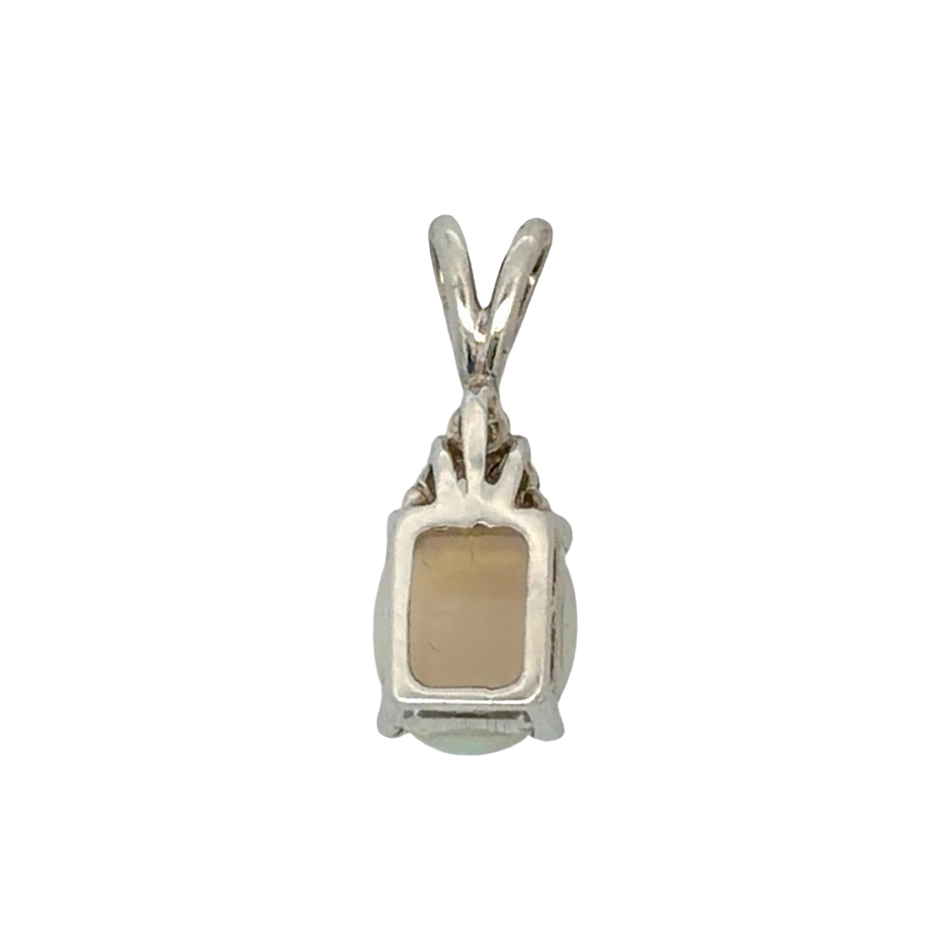 Back of white gold opal pendant on a white background