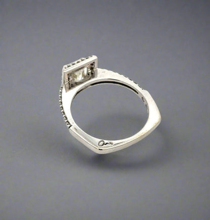 "a" signature with small round diamond on shank