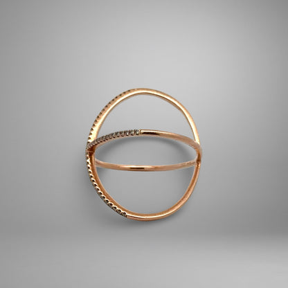 Rose gold ring with small stones on a gray background