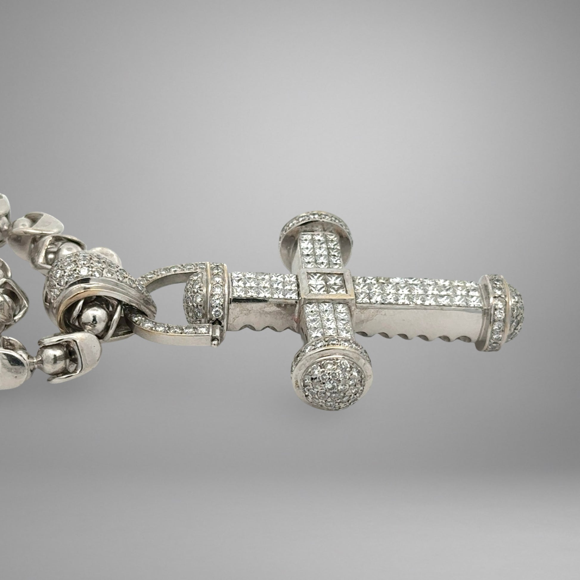 Side of cross pendant with diamonds