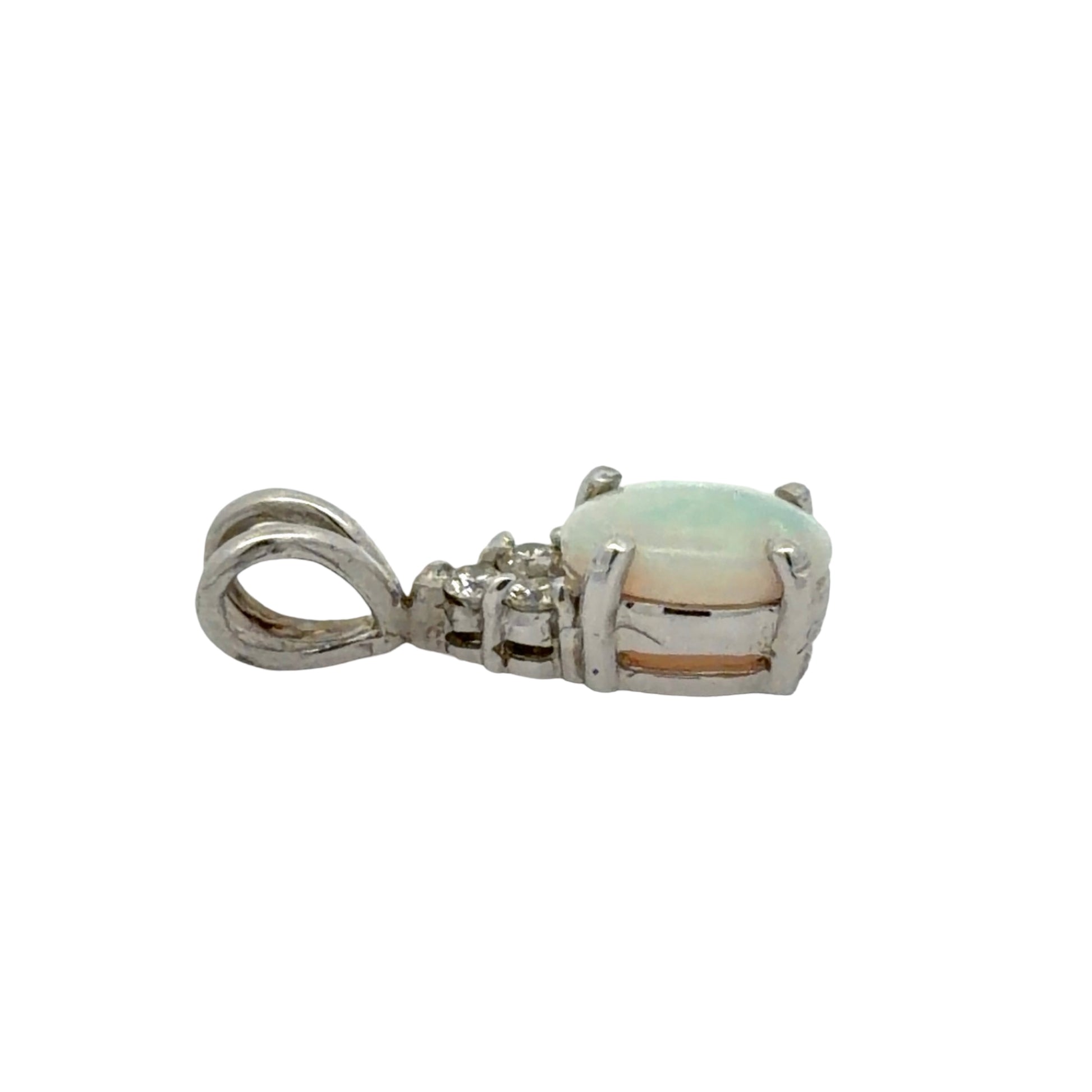 Side of white gold opal pendant on a white background