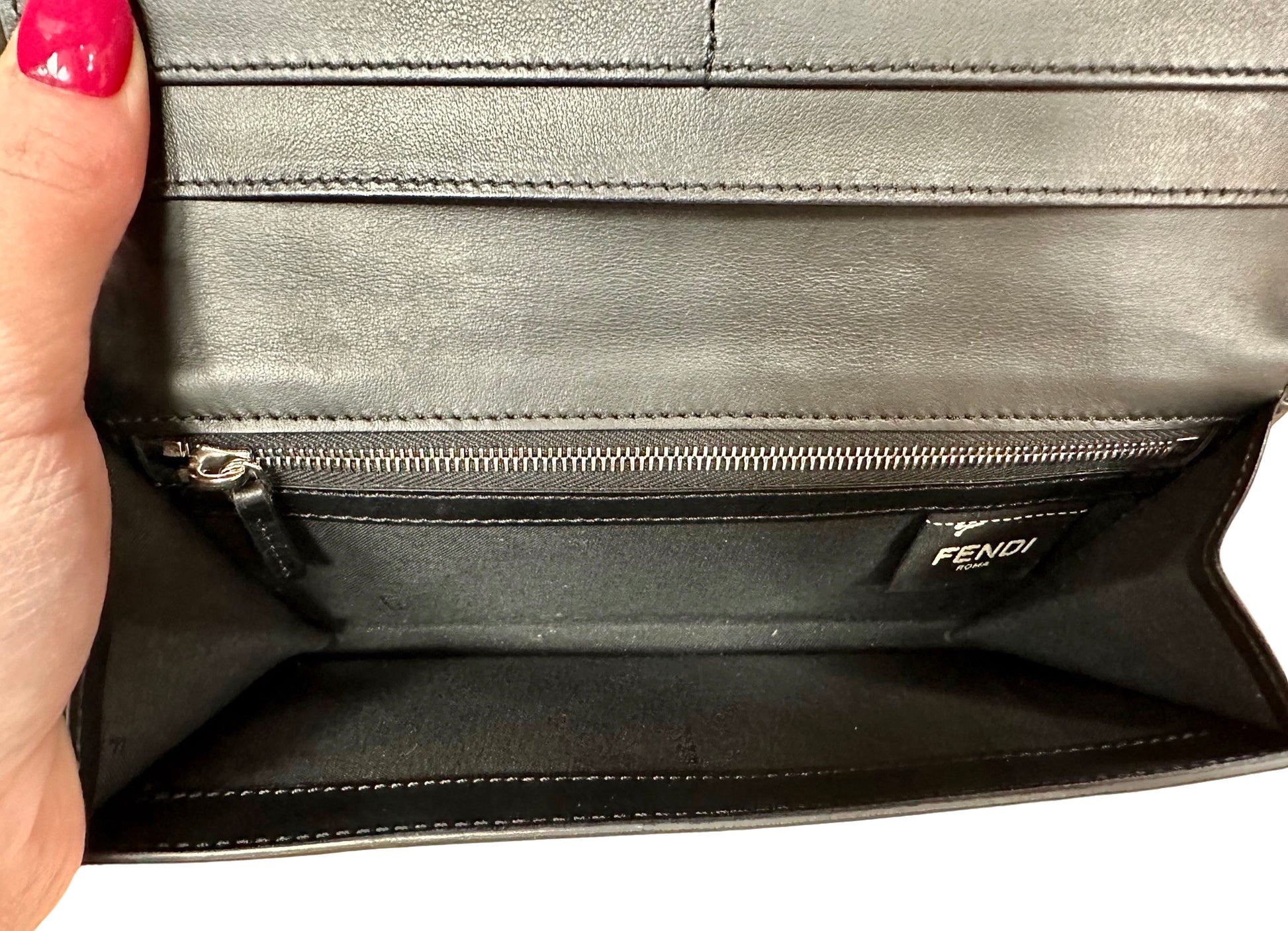 Big inner pocket of wallet with zip pocket + fendi tag