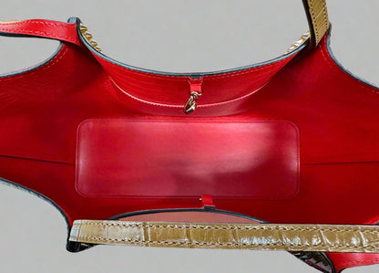 Red leather interior with gold clasp closure. 1 Interior side pocket