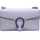 White textured leather gucci dionysus bag with small mark above the snake detail. Metal snake closure