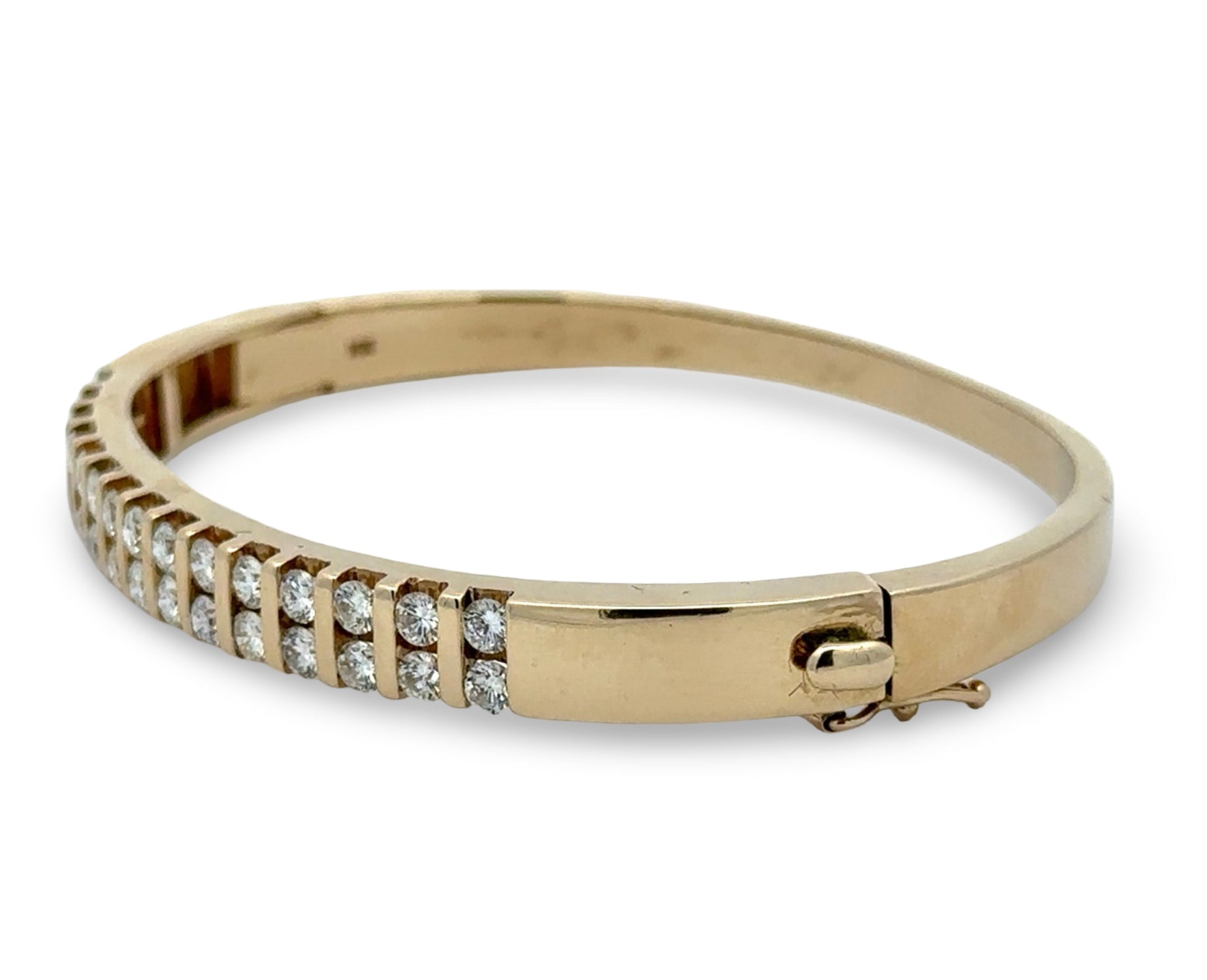 Gold bracelet with diamond accents on a white background