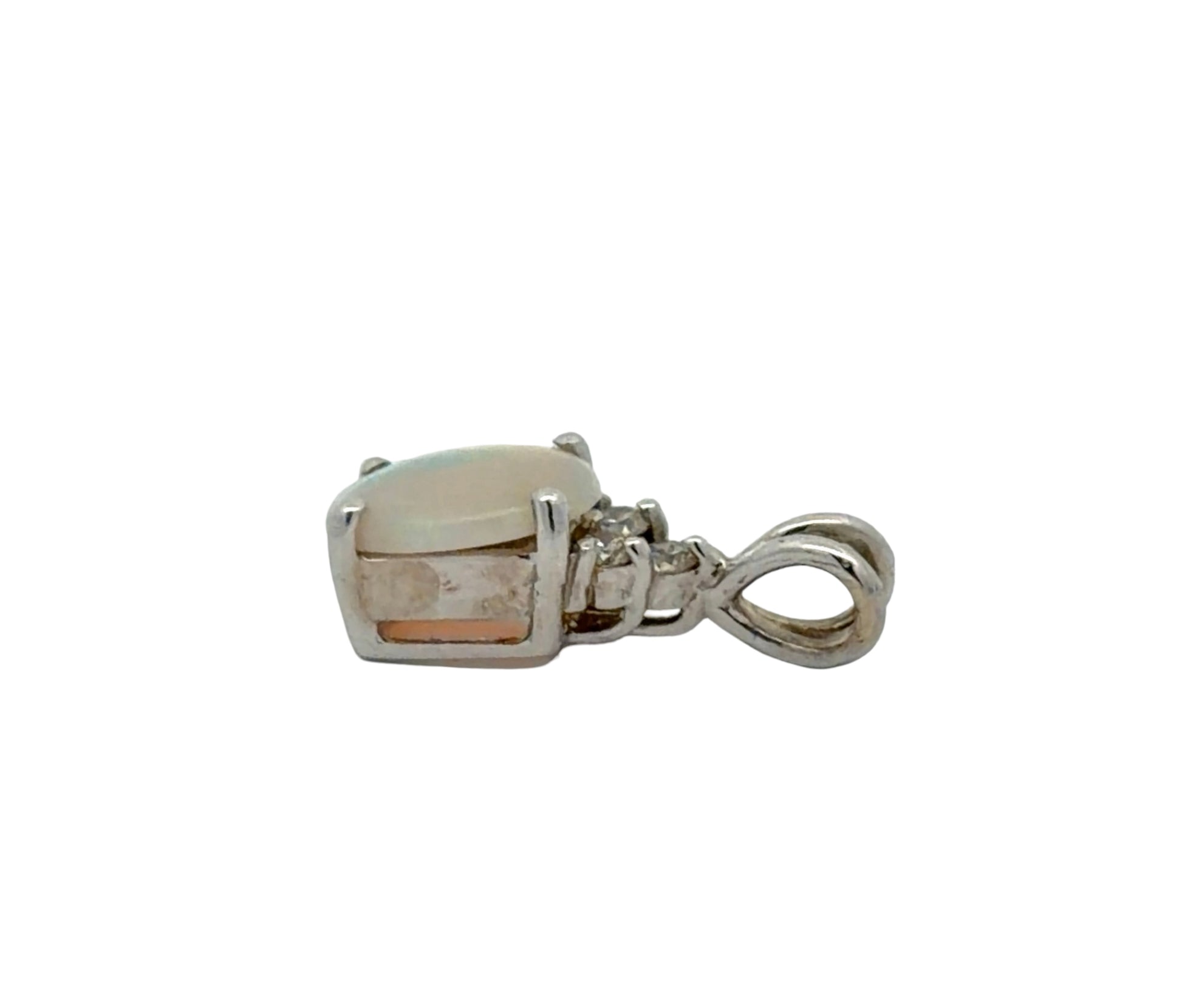 Side of white gold opal pendant on a white background