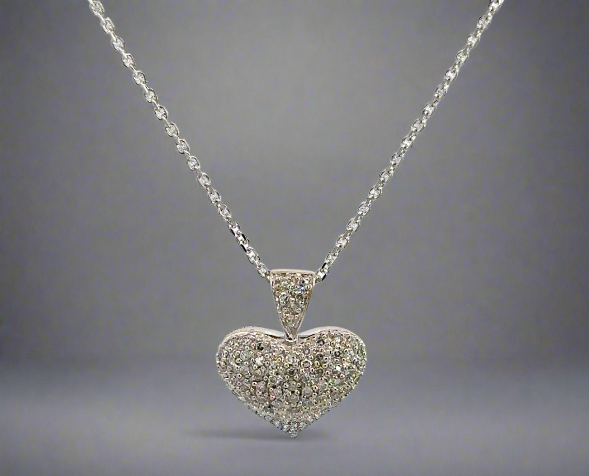 360 video of pave set diamond heart necklace