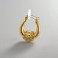 360 video of yellow gold hoops with bow detailing