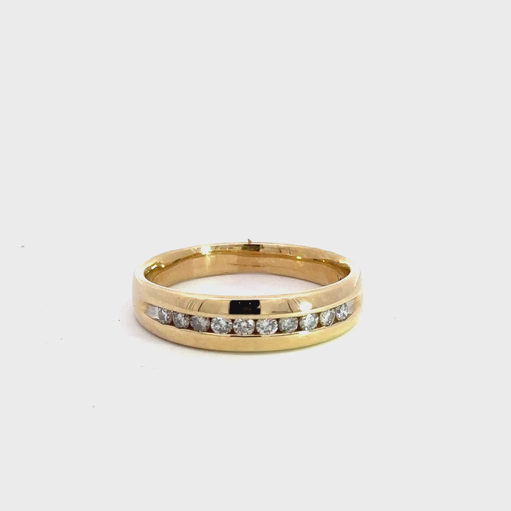 360 video of yellow gold diamond band ring with 10 round diamonds on half the band 