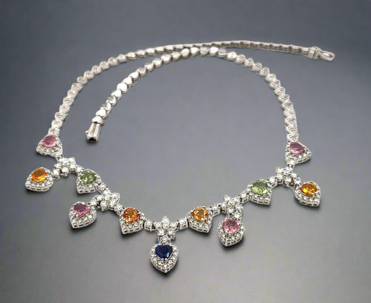 360 video of white gold diamond heart tennis necklace and colored gemstones