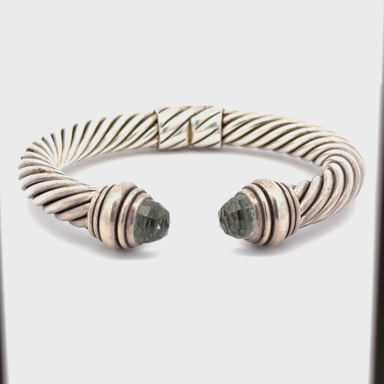 360 Video of silver bracelet with an open front. Scratches + dents on silver.