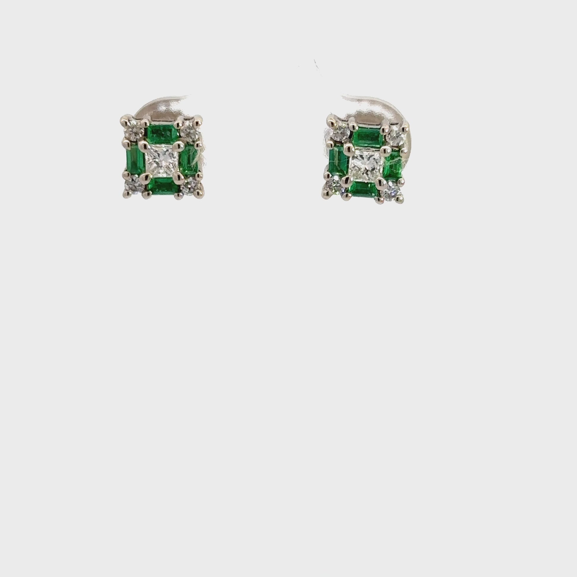 360 Video of pair of emerald + diamond earrings
