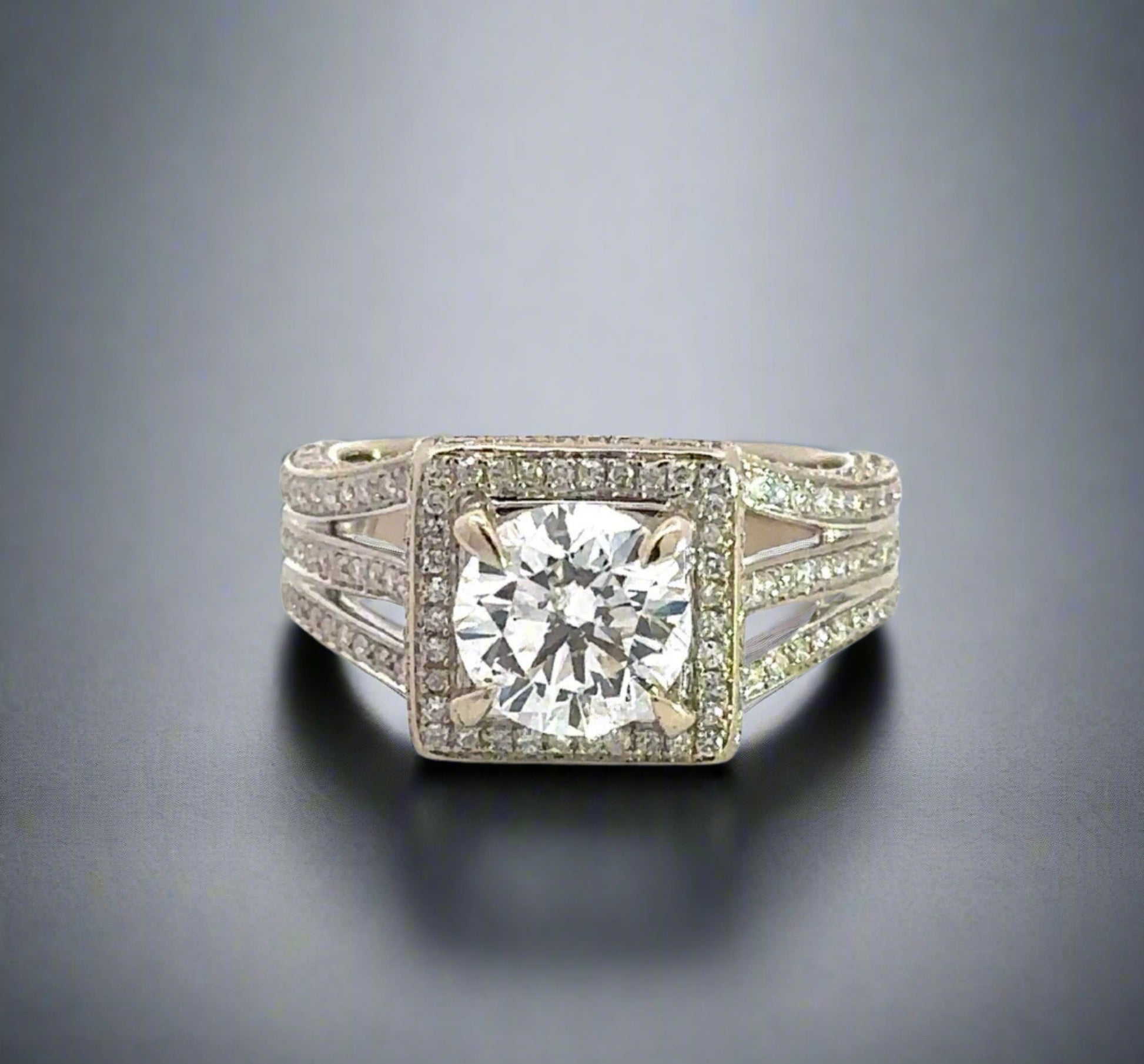 360 video of white gold diamond ring with 1.75 carat center-stone, diamonds around center-stone, diamonds on band in 3 rows, and diamonds on prongs