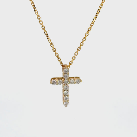 360 Video of diamond cross necklace on thin yellow gold link chain