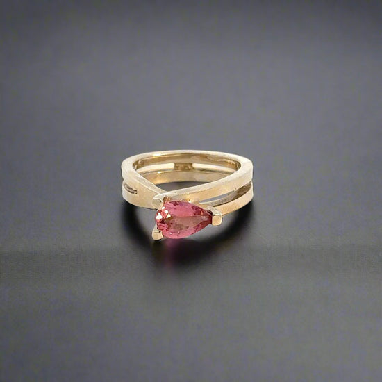 360 video of yellow gold infinity sign ring with pink pear-shaped gemstone