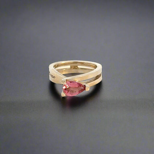 360 video of yellow gold infinity sign ring with pink pear-shaped gemstone