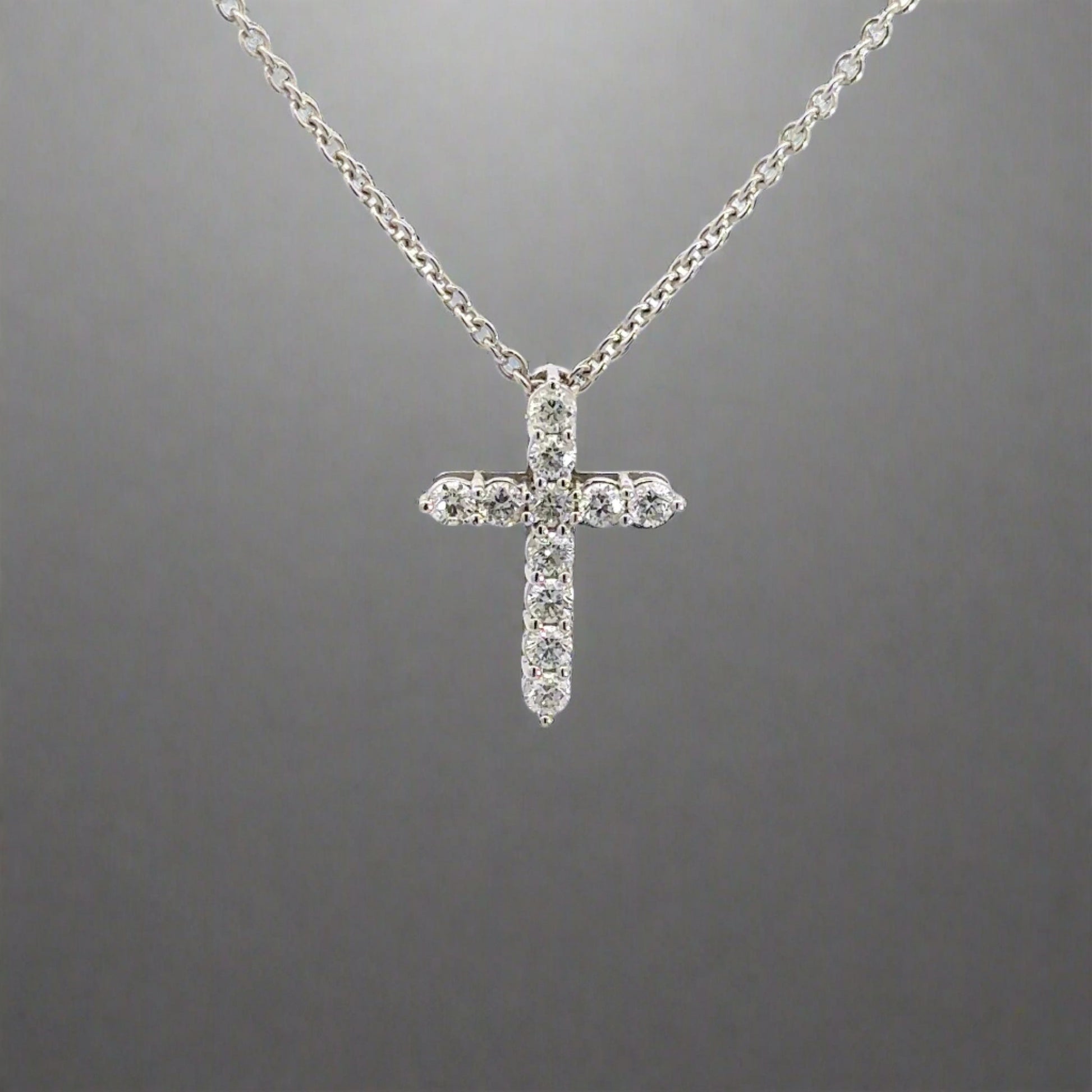 360 video of white gold diamond cross necklace