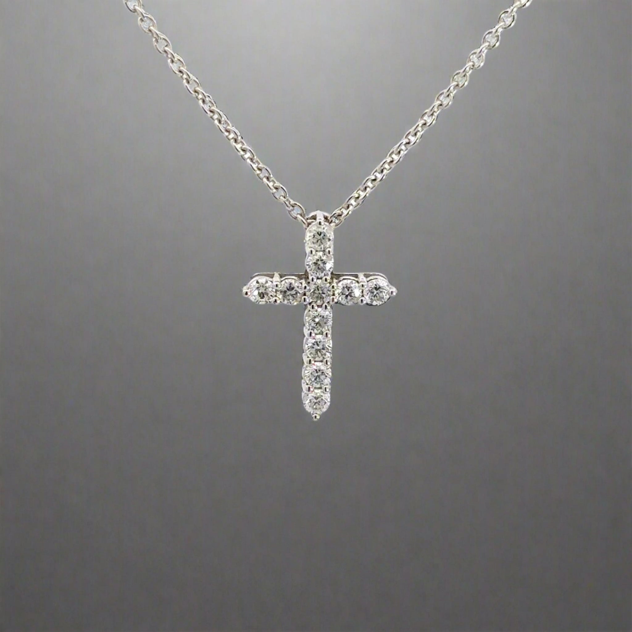 360 video of white gold diamond cross necklace