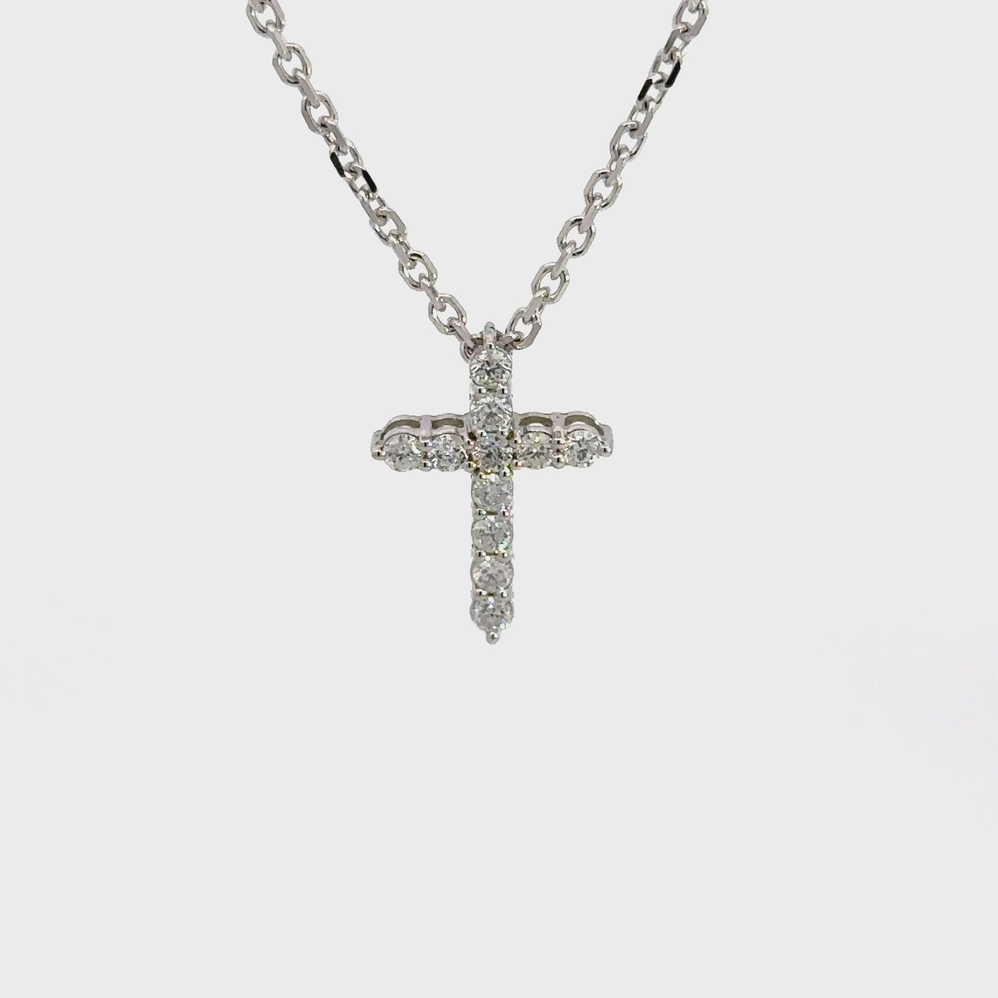360 Video of white gold diamond cross on thin white gold link chain