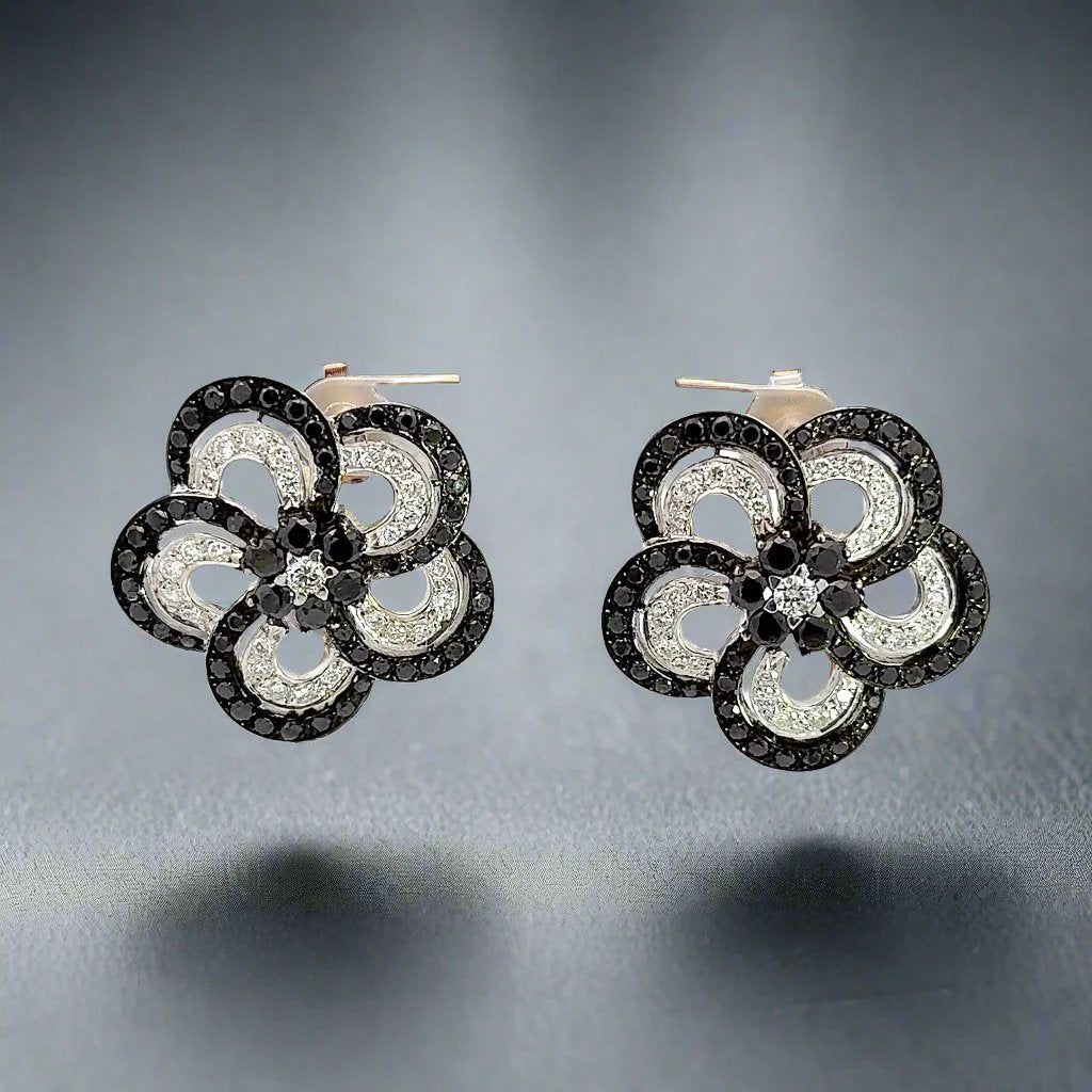 Video of black + white diamond flower earrings in white gold