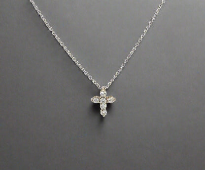 360 video of mini white gold diamond cross necklace