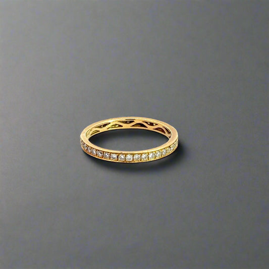 360 degree video of 18K yellow gold diamond band ring with small round diamonds all the way around the band