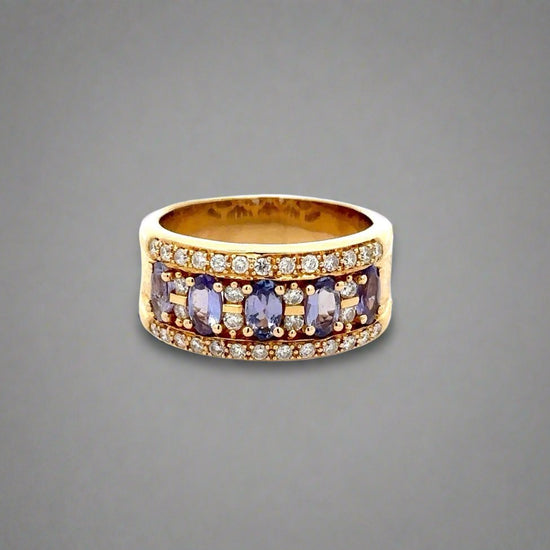 360 Video of yellow gold band ring with small round diamonds and 5 light blueish-purple oval colored gemstones and scratches on gold