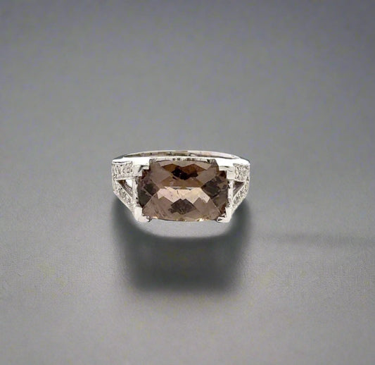 360 video of white gold ring with small round diamonds on the band and oval-shaped smoky quartz gemstone in the center.