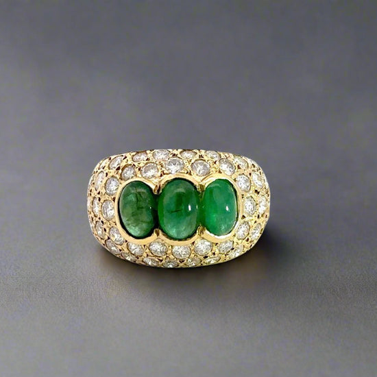 360 video of yellow gold ring with diamonds + 3 emerald dome shaped gemstones