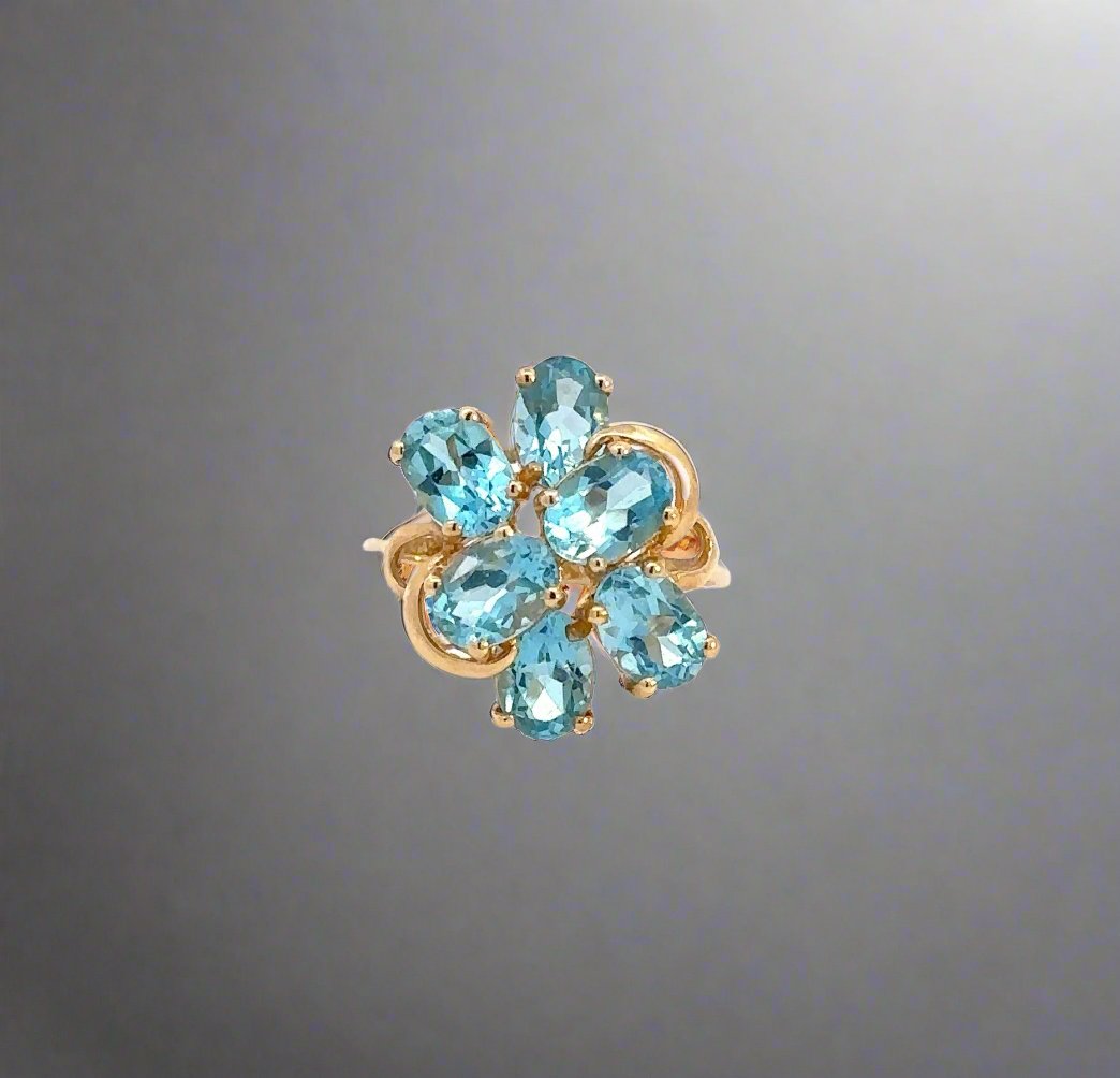 360 video of yellow gold ring with 6 blue oval-shaped gemstones