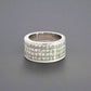 360 video of white gold band ring with 4 rows of princess-cut diamonds on the front
