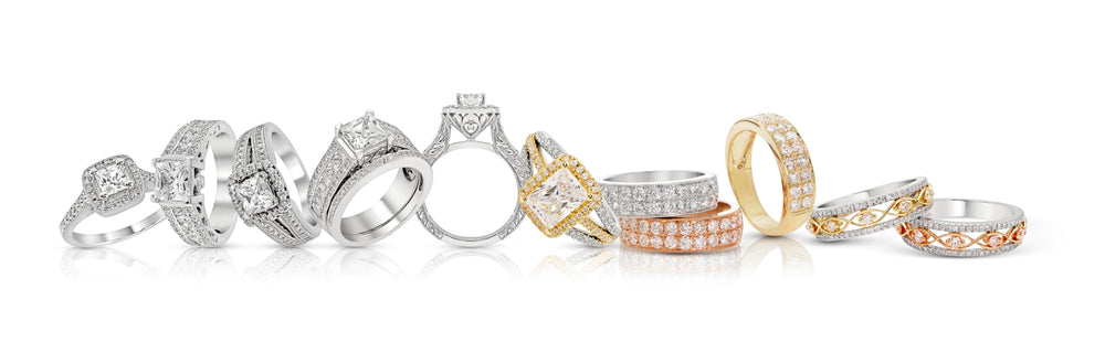 Picture of white gold, rose gold, and yellow gold diamond bands and engagement rings